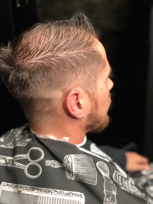 Men's haircut by Nicolette Leasure at Blades&Bottles in Modesto, CA 95354 on Frizo
